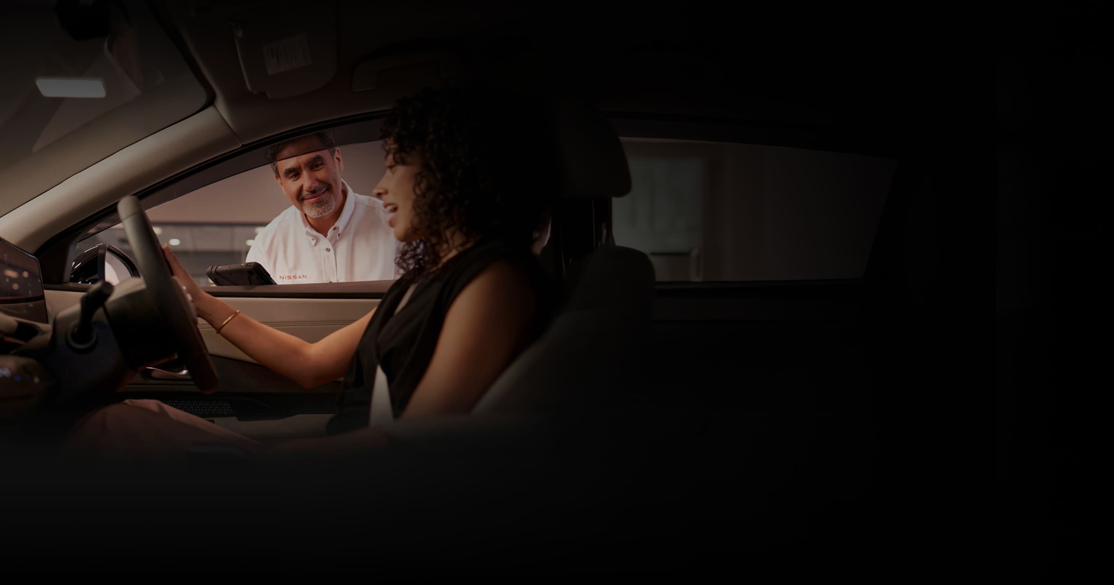 Explore new Nissan vehicles at Jim Shorkey Gainesville Nissan in Gainesville, GA — showroom with sales staff and cars