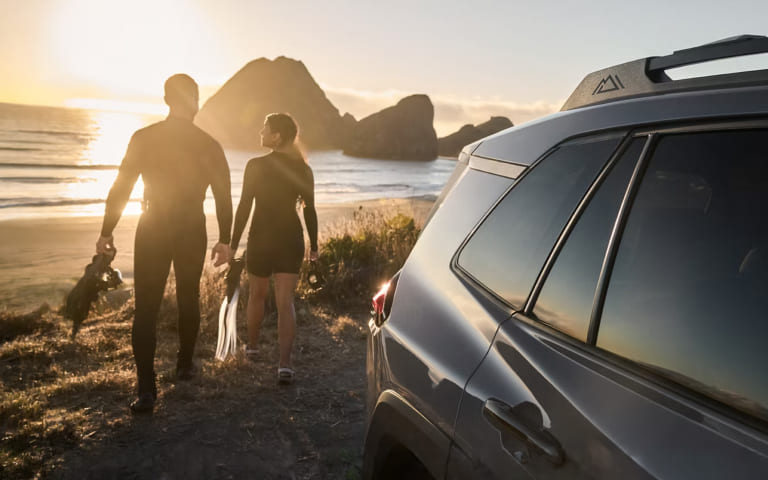 Customer walking near a Toyota SUV while exploring lease-end options