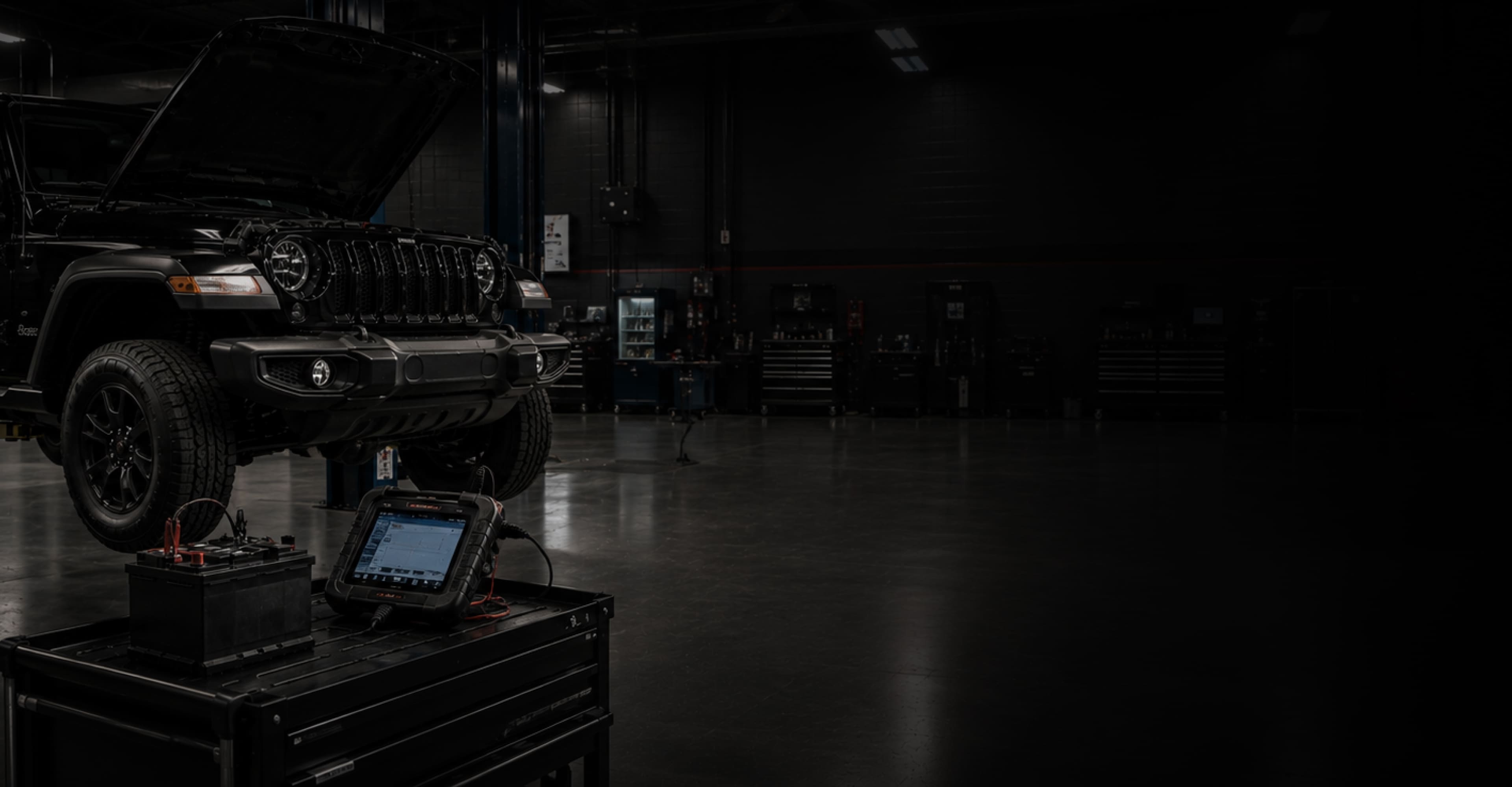 Factory-trained technicians providing vehicle battery testing and replacement service at Jim Shorkey CDJR