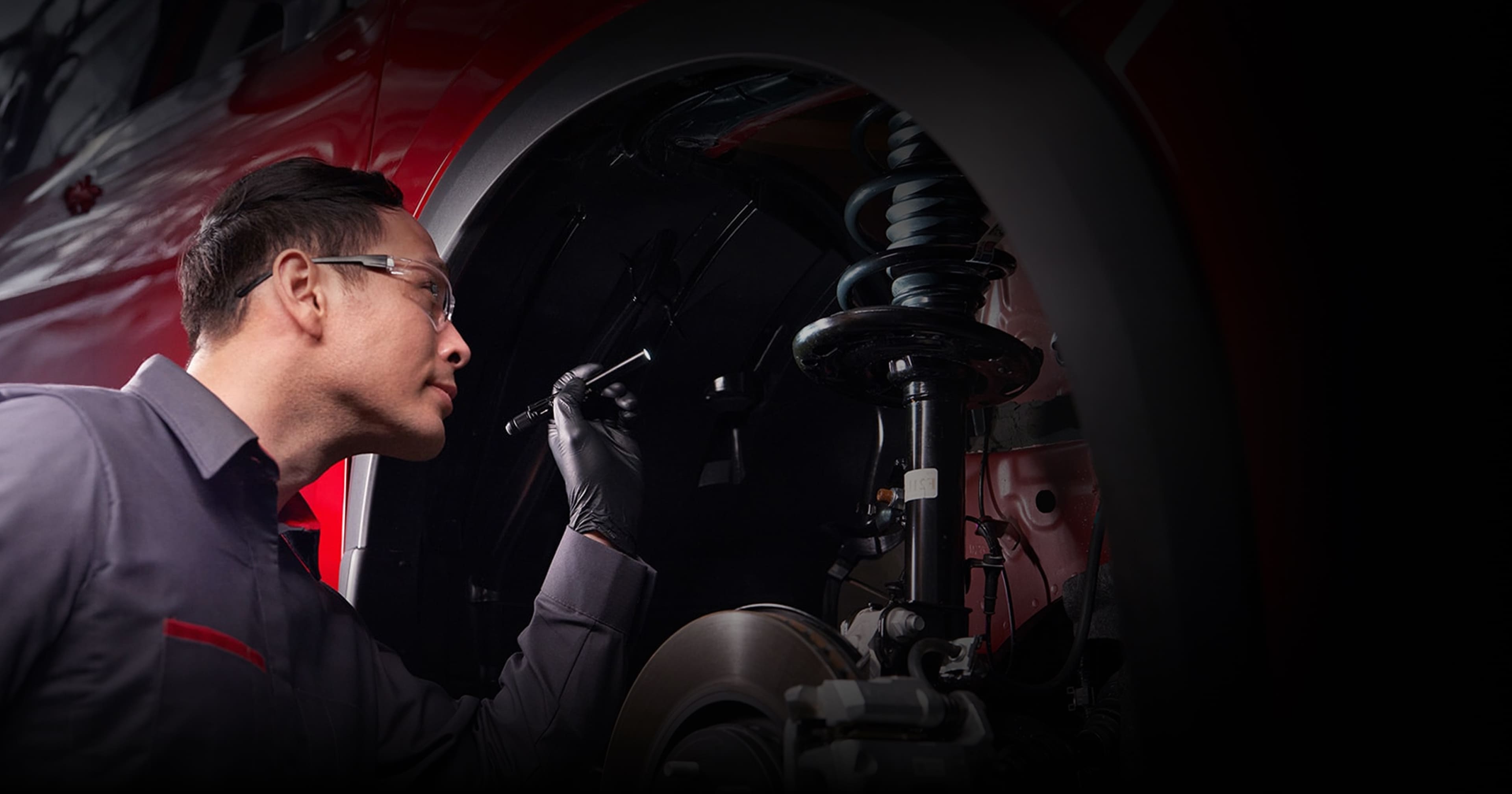 Nissan service and parts department at Jim Shorkey Nissan Gainesville in Gainesville, GA with technicians and service bays